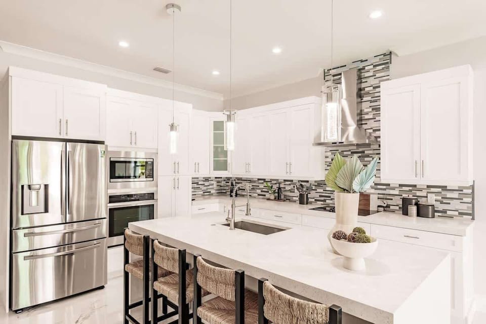 The massive refrigerator/freezer combo can accommodate all of your groceries! | Coastal Sol by Boutiq Luxury Vacation Rentals | Naples, Florida