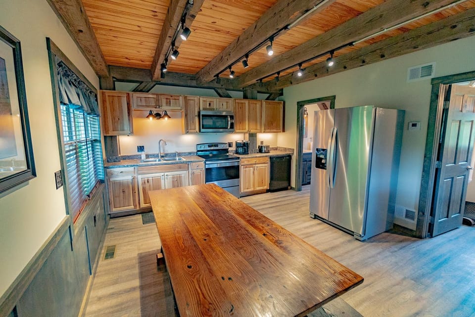 Kitchen - Main Level. WIth long wooden table, great for preparing