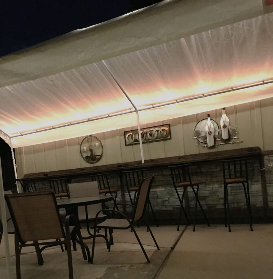 Nighttime is the right time for entertaining friends at the patio bar.