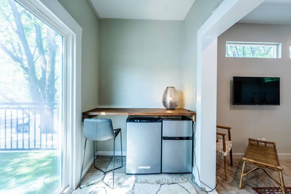 This area now has two seats for eating and working on the computer (the mini fridge has been moved to another area)