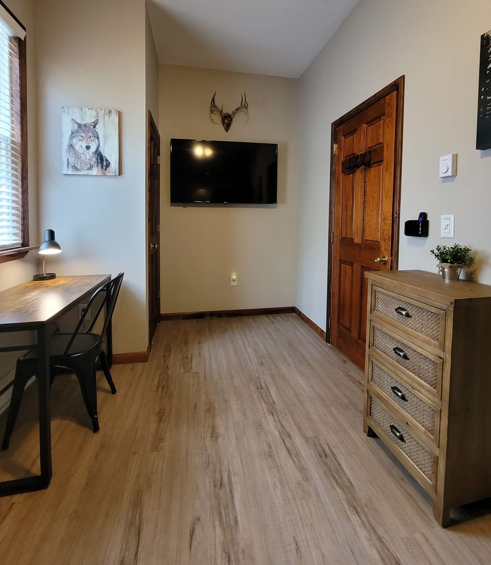 The Eagle's Nest Bedroom includes a private desk, closet, and a 55" Smart TV.