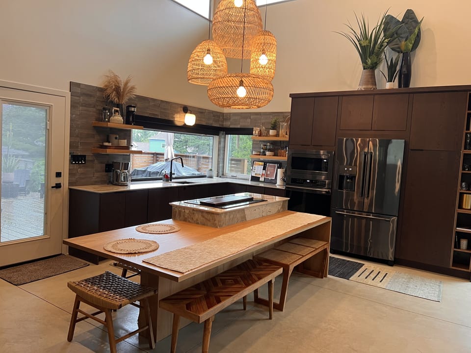 Open concept kitchen with table that can seat 8