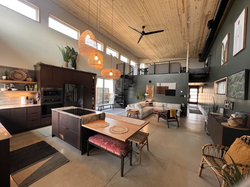 Slider door that leads out to the side deck and outdoor shower