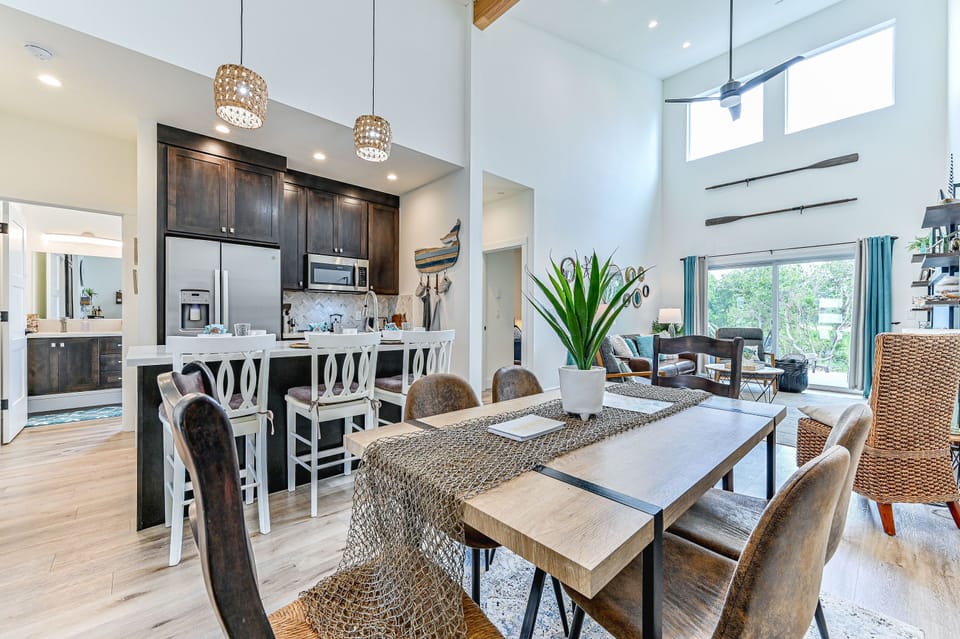 Great Room A with soaring ceilings and tons of natural light - there's a connecting door to Side B which allows you to open the entire house up as one, or keep closed when one side needs privacy.  