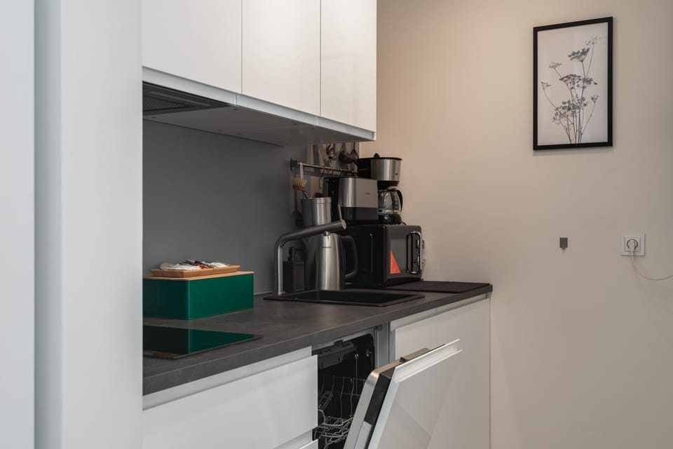 The kitchen offers a functional layout for convenient cooking. 