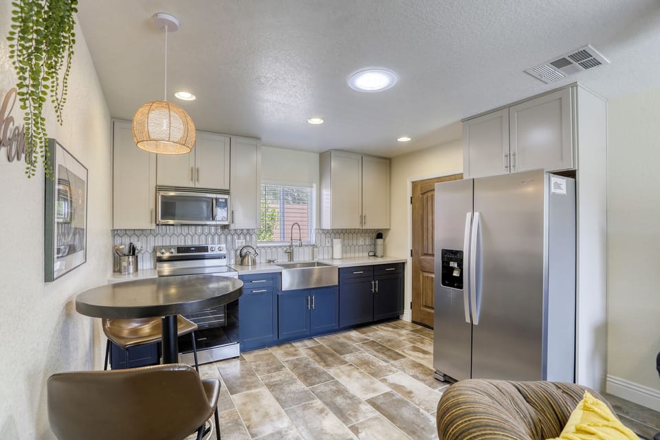 kitchen with full sized refrigerator/freezer, stove, oven, microwave & farm sink
