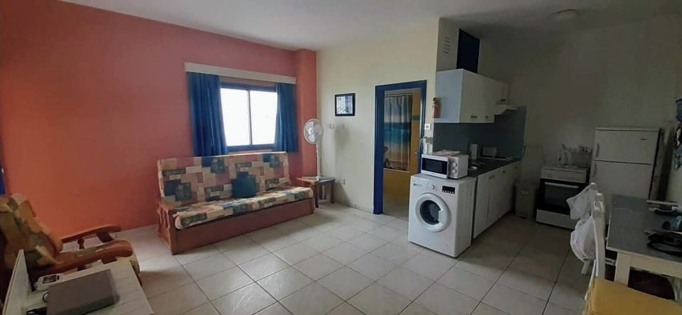 Lounge area with double sofa bed. Kitchenette, private bathroom & shower.