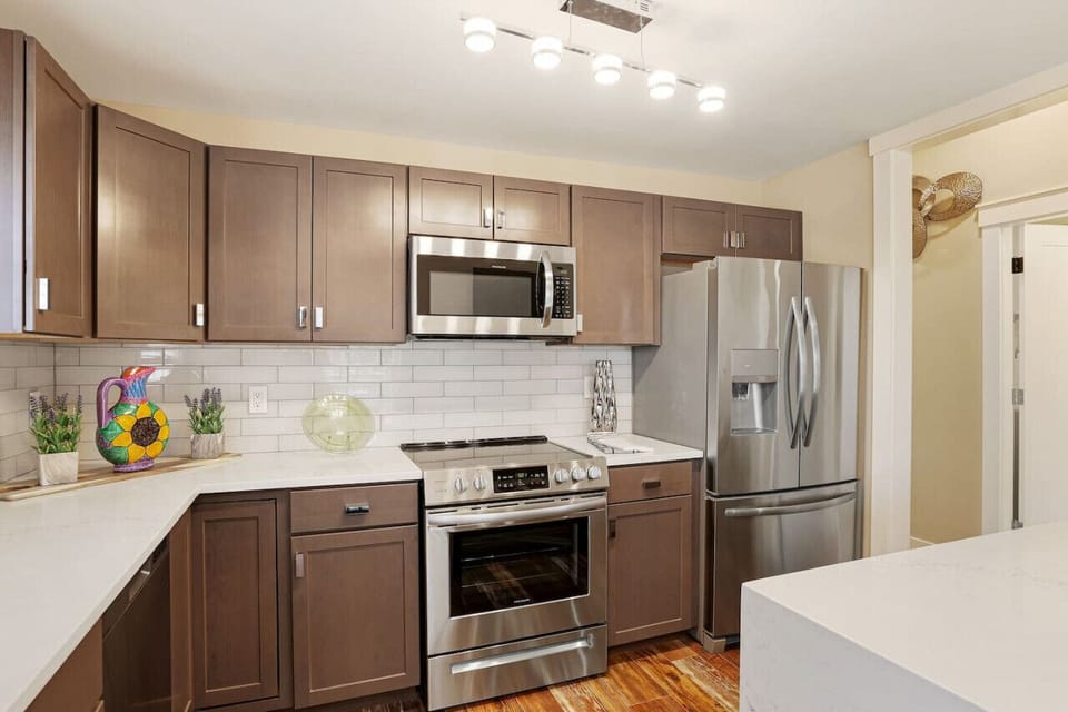 Fully stocked kitchen open into the dining room with a view of a lake.Seattle /Tacoma Area.