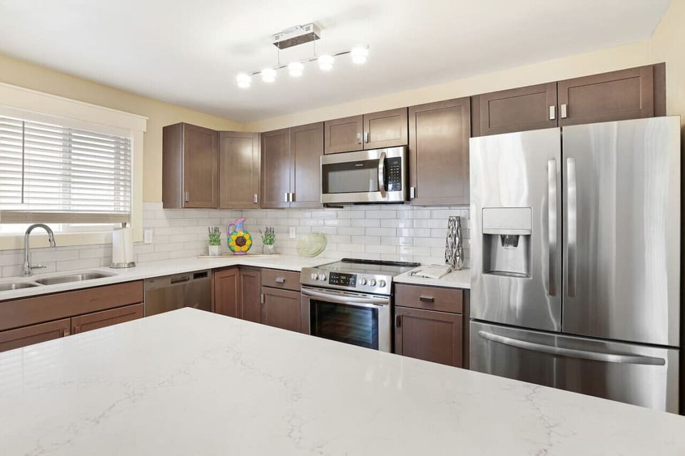 Fully stocked kitchen open into the dining room with a view of a lake.Seattle /Tacoma Area.