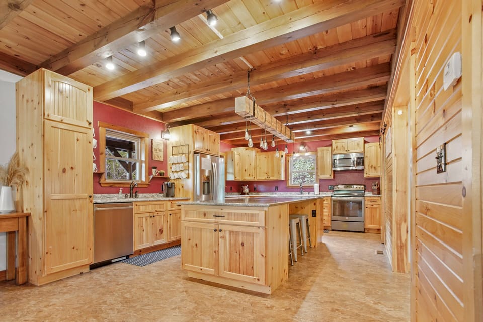 This kitchen is fully-equipped with all of your cooking needs for your stay! This large island has 3 stools, and is the perfect spot for displaying all of your tasty dishes for the crew!