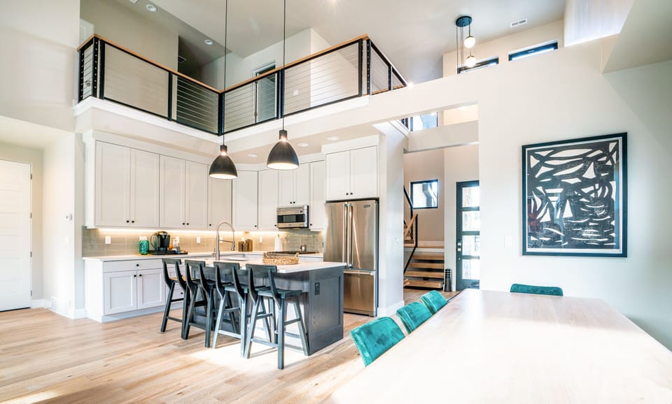 Brand new modern space with vaulted ceilings, Viking appliances, and curated artwork. 