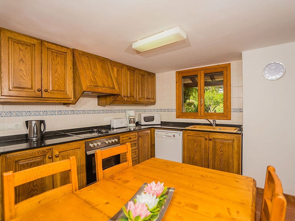 Room, Property, Furniture, Kitchen, Cabinetry, Countertop, Interior Design, Building, Yellow, House