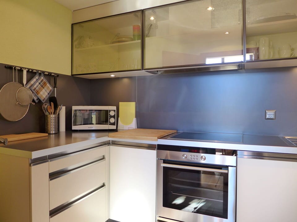 Countertop, Cabinetry, Furniture, Kitchen Stove, Kitchen Appliance, Kitchen, Home Appliance, Wood, Lighting, Interior Design
