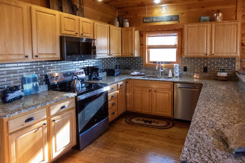 The spacious fully functioning kitchen is ready to meet all of your cooking needs.