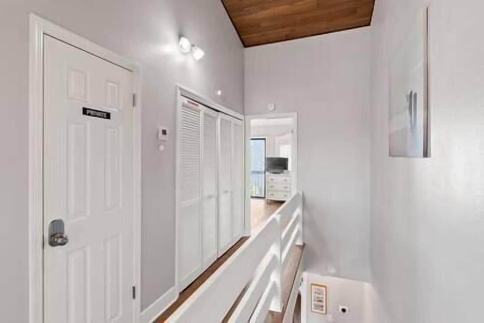 Upstairs hallway. Laundry (full-size washer and dryer) are located in bi-fold closet area. 