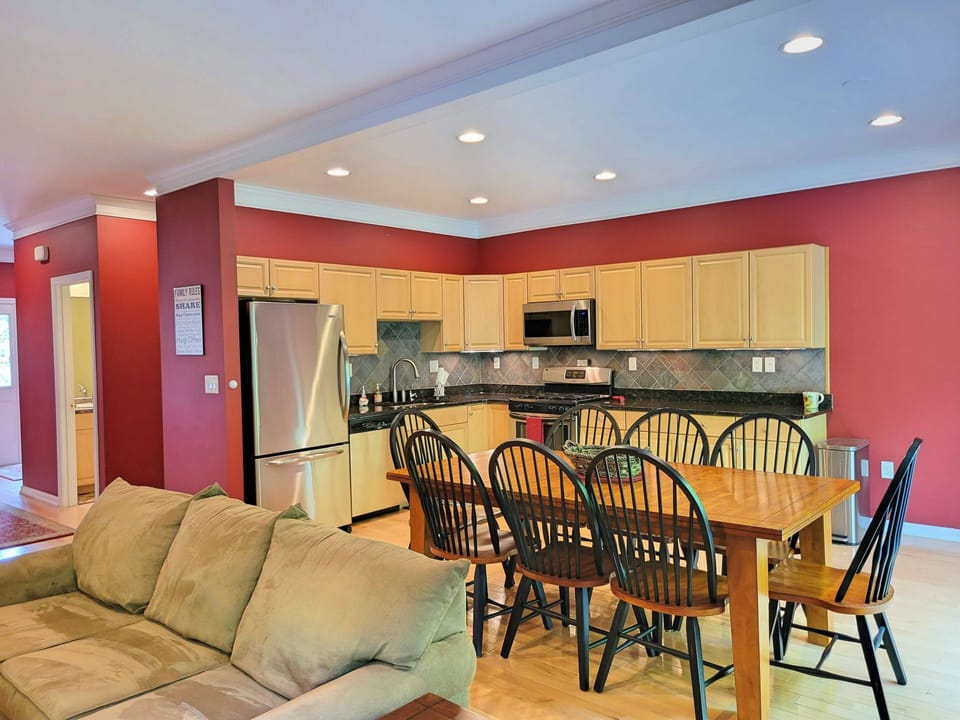 Dining area and kitchen, w/ half bath to left