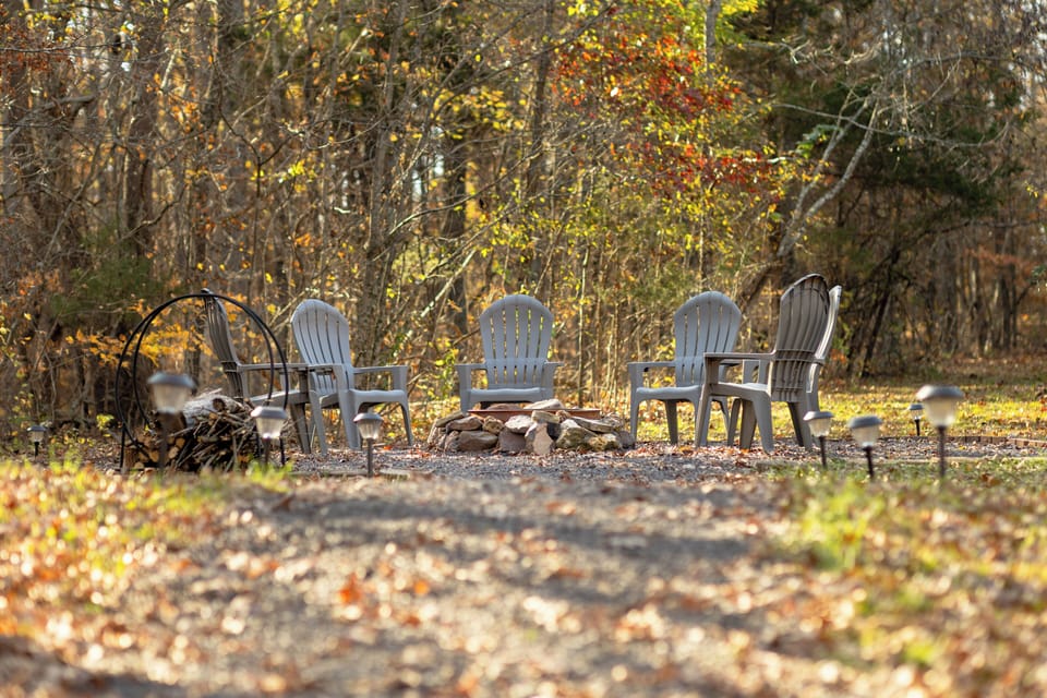 Fire Pit Area.  Chairs include drink holder that swings out under arm rest