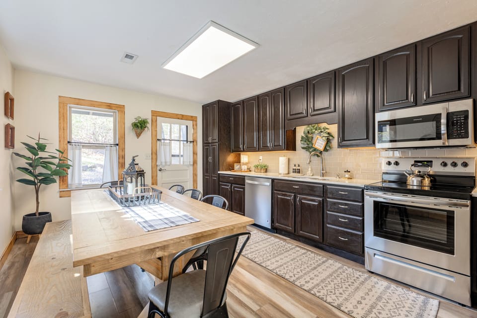 Fully stocked Kitchen with ample seating around Farmhouse Table