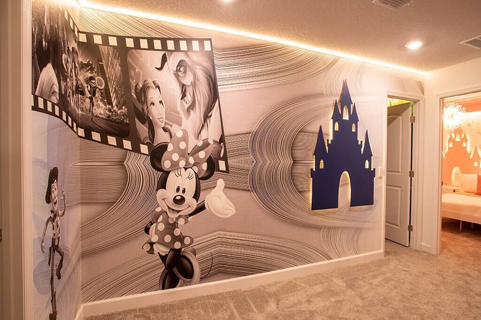 Enter a whimsical hall filled with vibrant murals of beloved characters, creating a playful atmosphere. The soft beige carpeting and warm lighting highlight the enchanting decor, making every moment truly magical for our guests.
