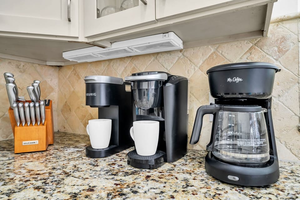Our kitchen is fully stocked with dishes, silverware, utensils, cookware, bakeware, and a variety of small appliances.