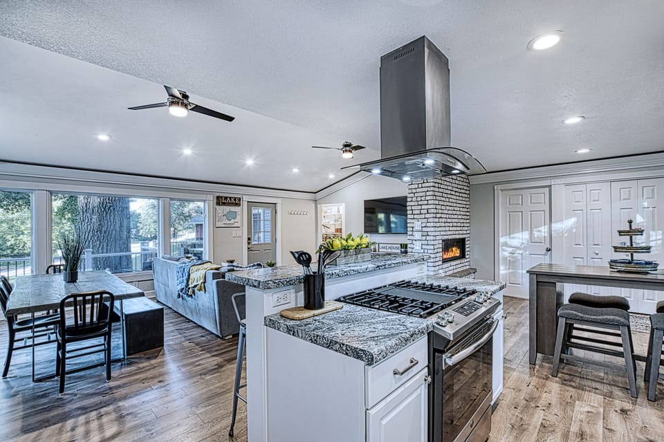 The kitchen faces the Open Concept space and looks out to the Lake. 