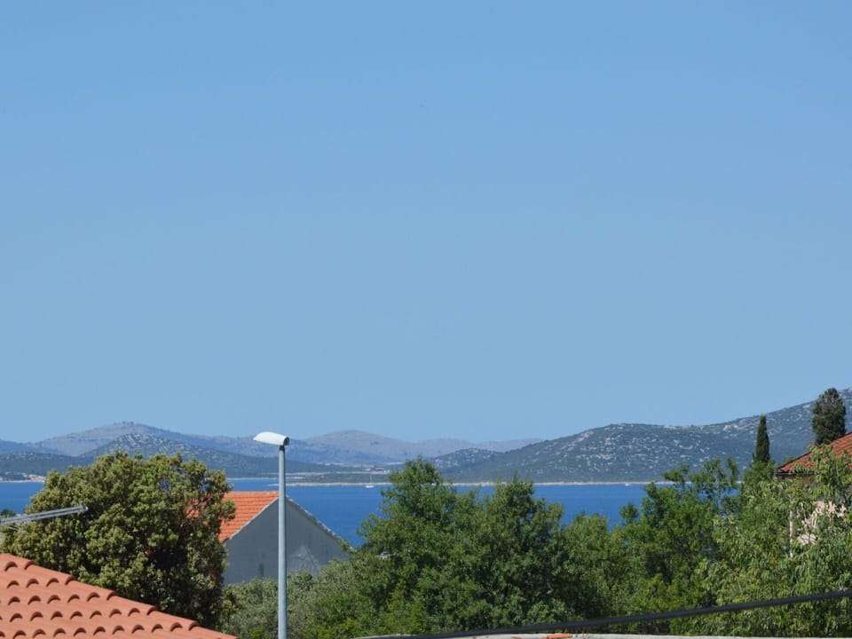 Sky, Water, Mountain, Tree, Horizon, Landscape, Street Light, Hill, Mountain Range, Slope