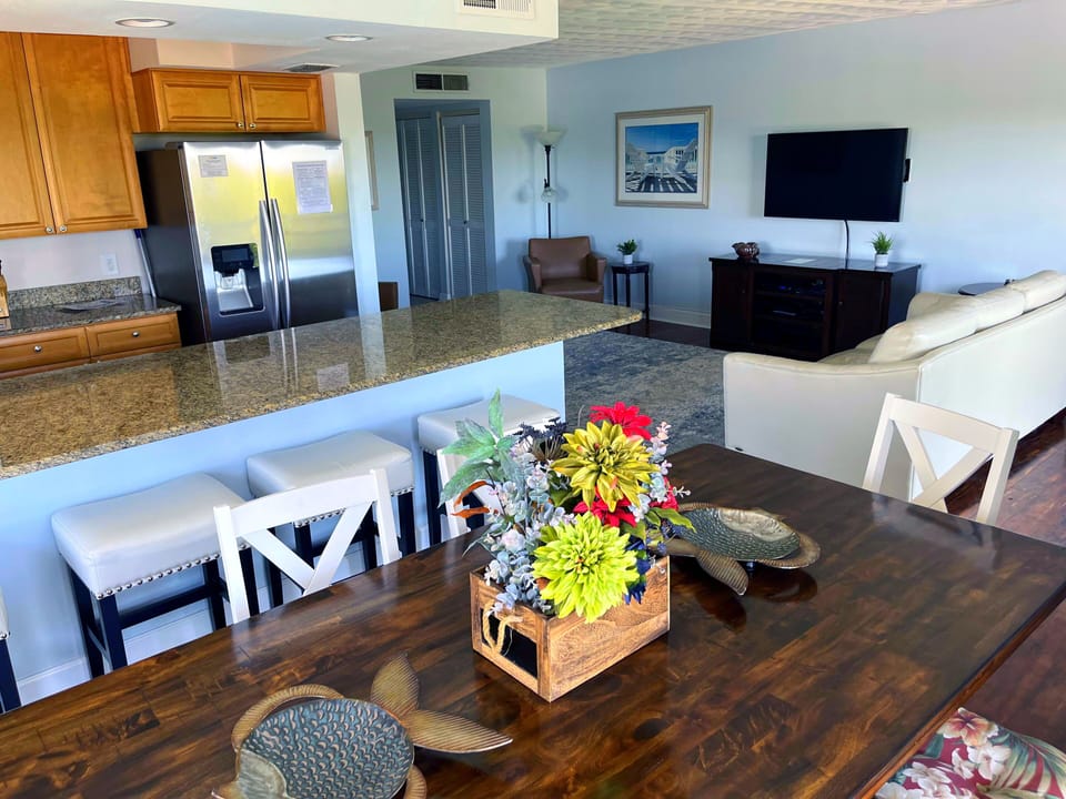 Renovated open concept kitchen makes this corner unit condo very spacious. 