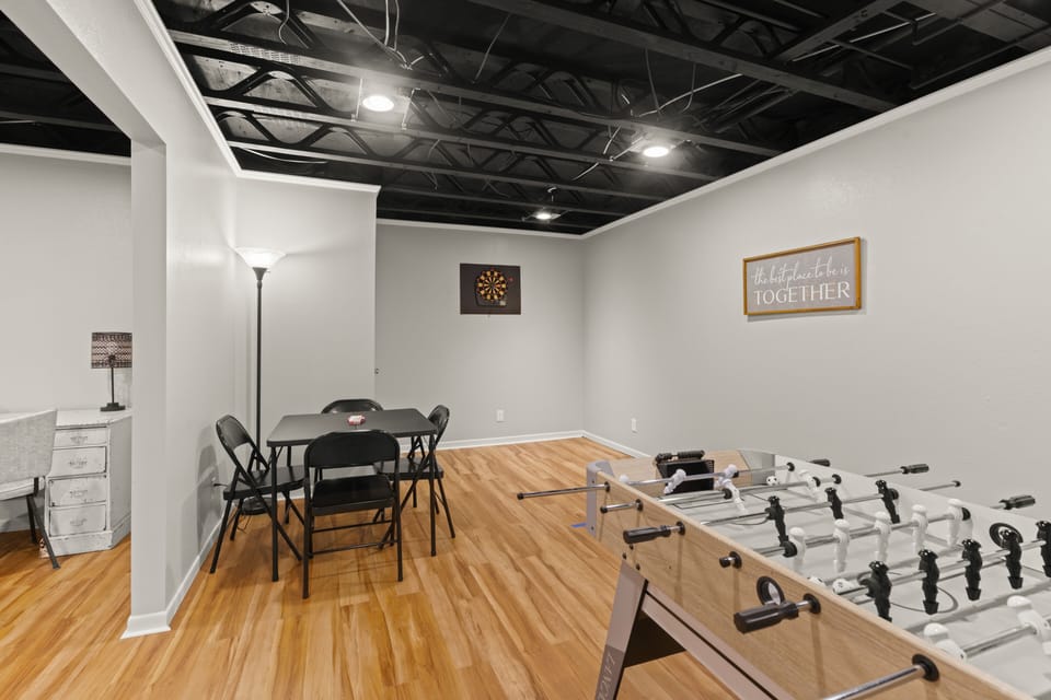 bonus game room with darts, cards, and foosball.
