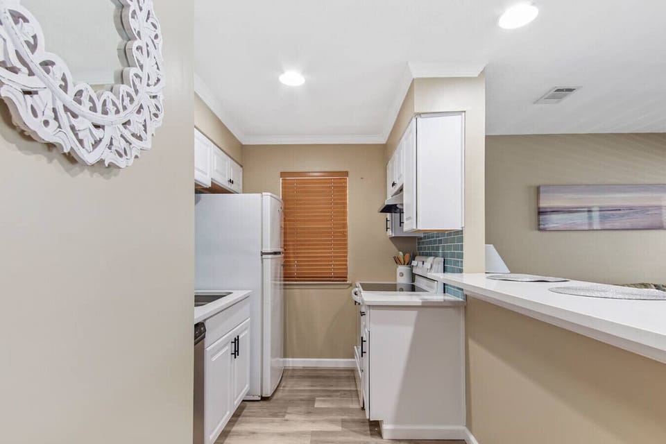 Kitchen with fridge, stove/over, dishwasher