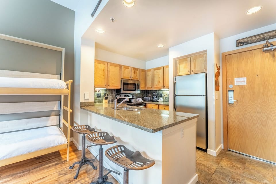 Breakfast bar with additional seating for three.