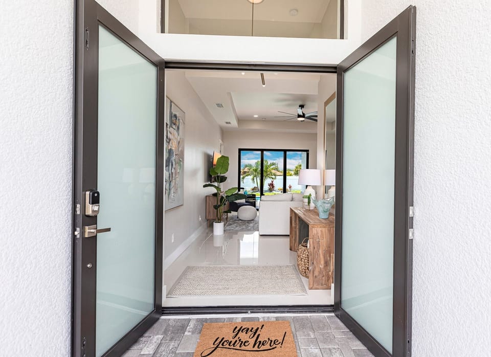8' Double doors, soaring 10' ceilings and light-filled spaces welcome you!