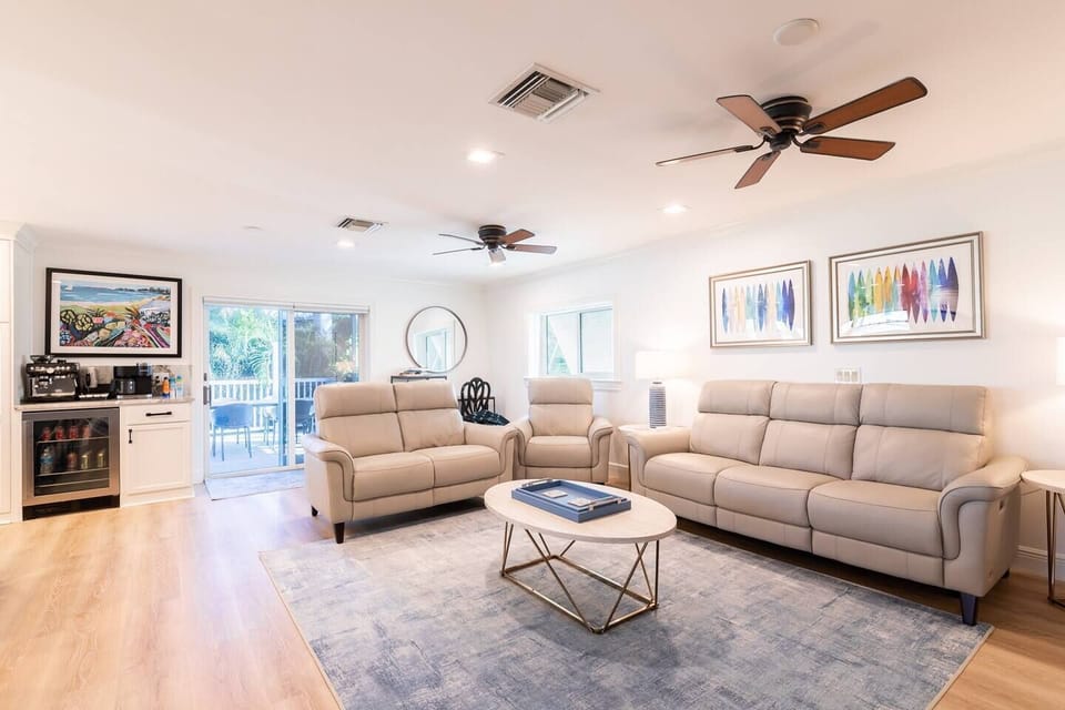 Upstairs living room adjoins the kitchen. This space has brand NEW, easy-to-clean leather sofa with dual, power recliners, love seat, power recliner (seating for the whole group!) around a 65" SMART TV + board/family games.