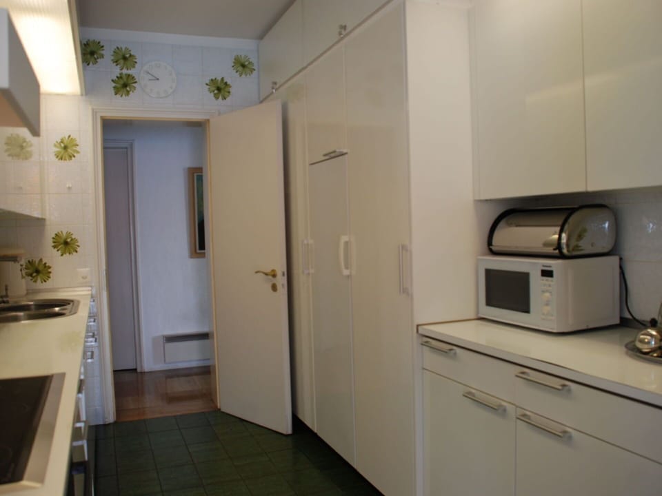 Furniture, Building, Door, Cabinetry, Interior Design, Plant, Lighting, Gas Stove, Kitchen Appliance, Home Appliance