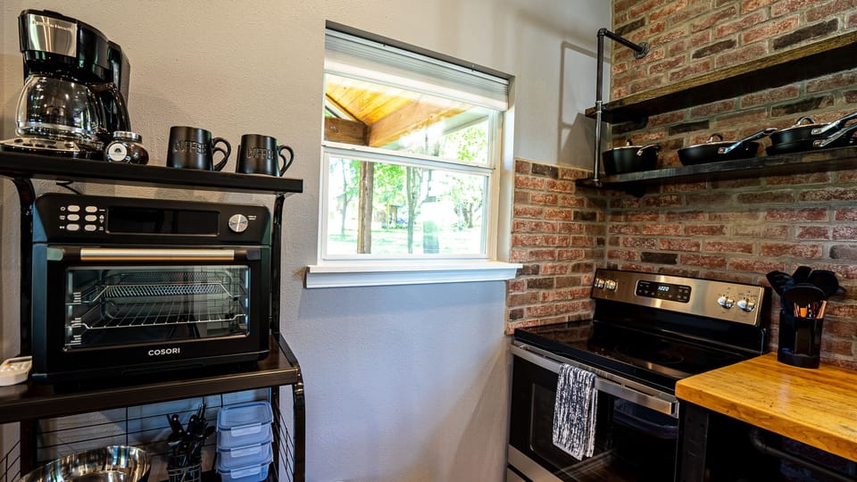 fully stocked kitchen w/ full size appliances,  coffee bar & toaster oven. 