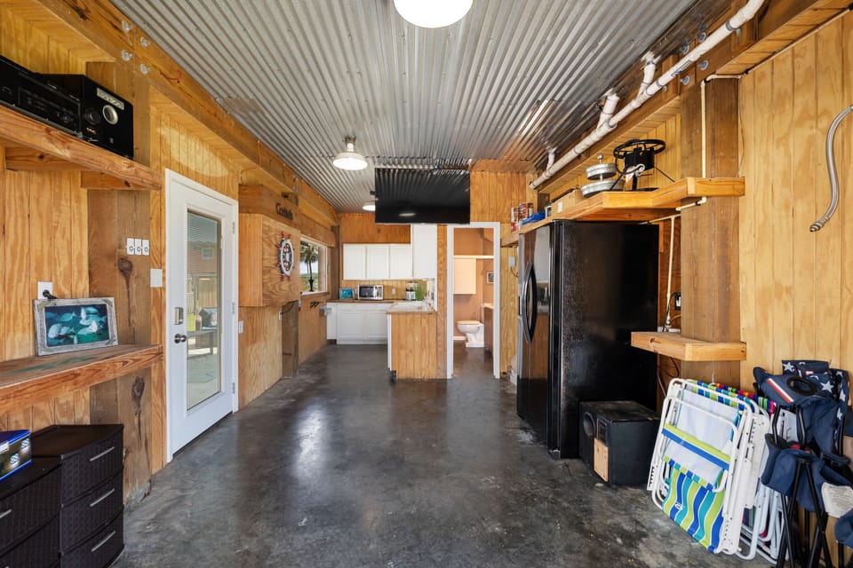 The garage has been converted to a secondary kitchen and a half bathroom. 