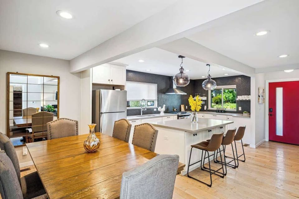 Open, inviting kitchen and dining space with plenty of room to cook, gather, and enjoy meals together in a bright, modern setting.
