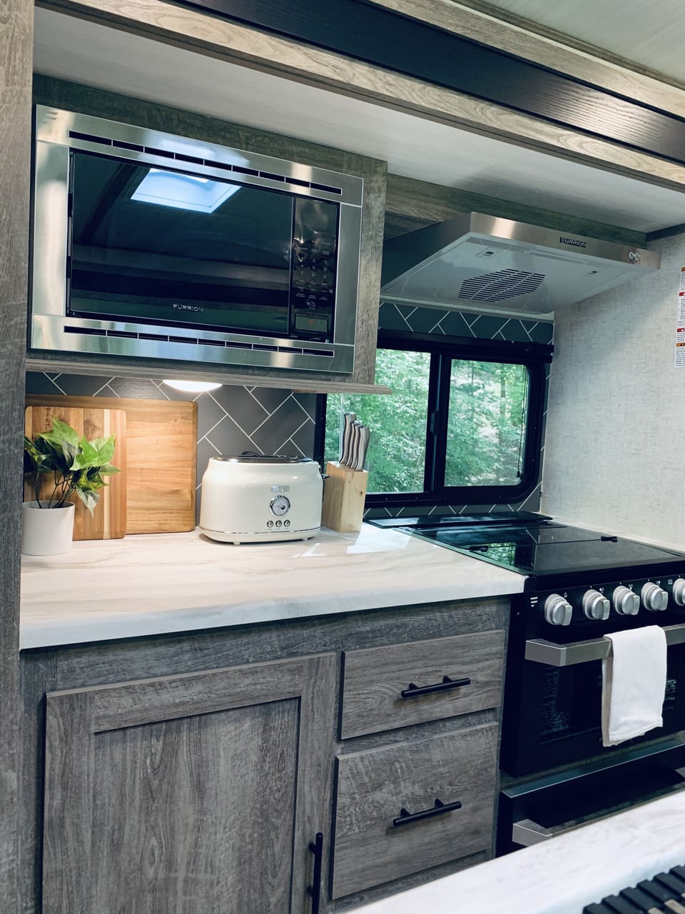 Microwave, gas stove and toaster. 