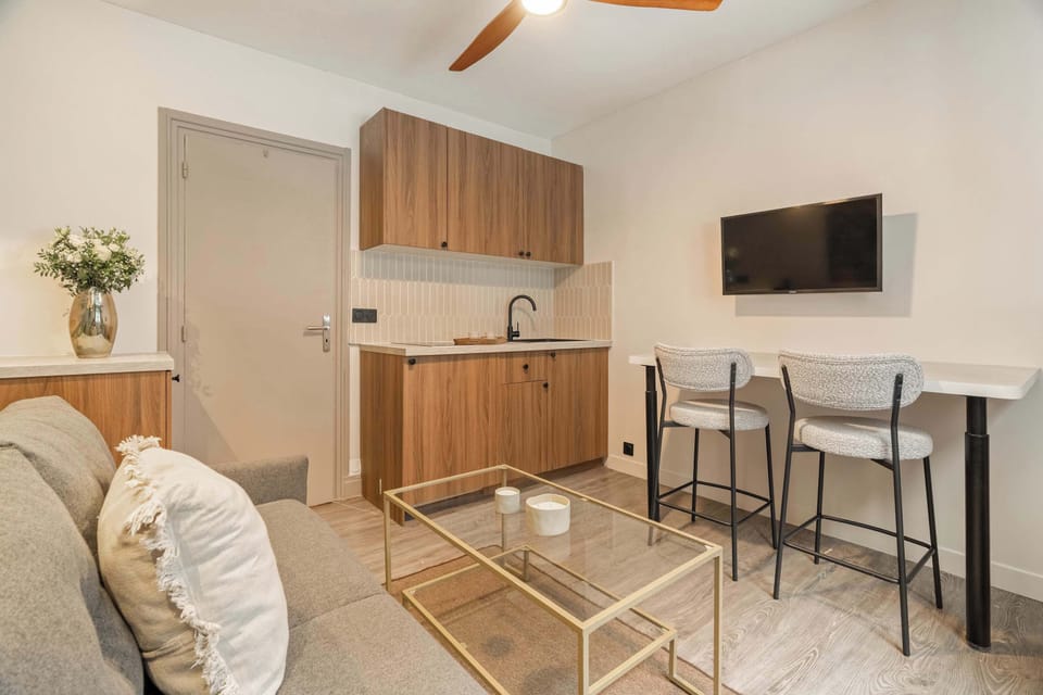 Unwind in the stylish living area, complete with a comfortable sofa.