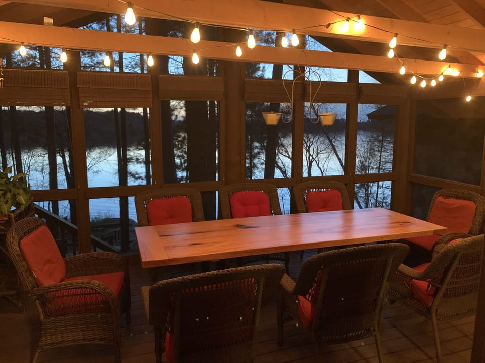 Screened in porch for relaxing and dining