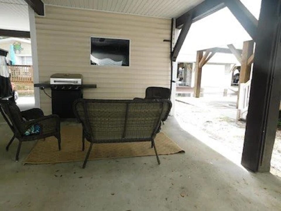Outdoor TV sitting area with Gas Grill