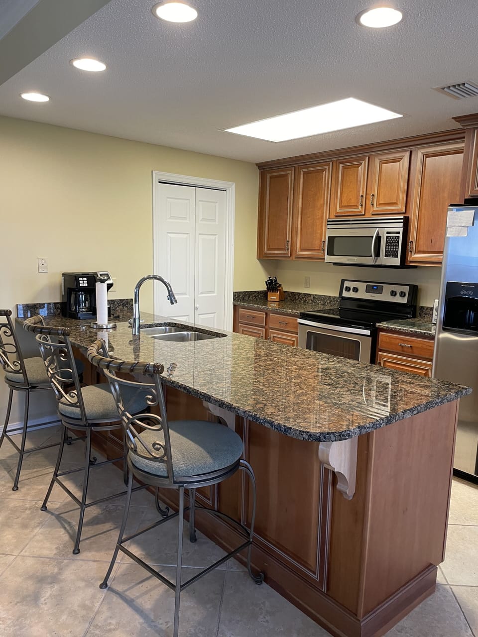 Fully stocked kitchen with granite counter tops