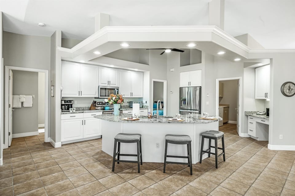 The kitchen is fully equipped & has additional seating for 3 at the bar