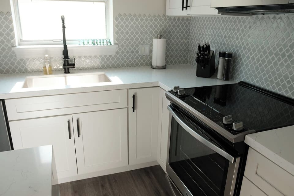 High-end stove oven, knife set, and faucet. 