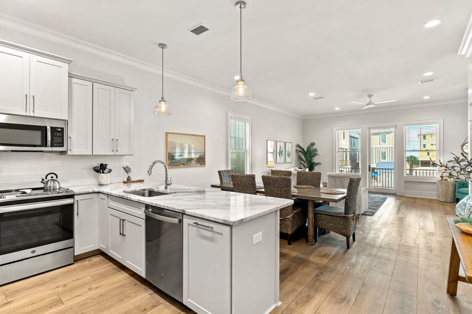 Dining table with 6 chairs plus 4 stools under counter.
