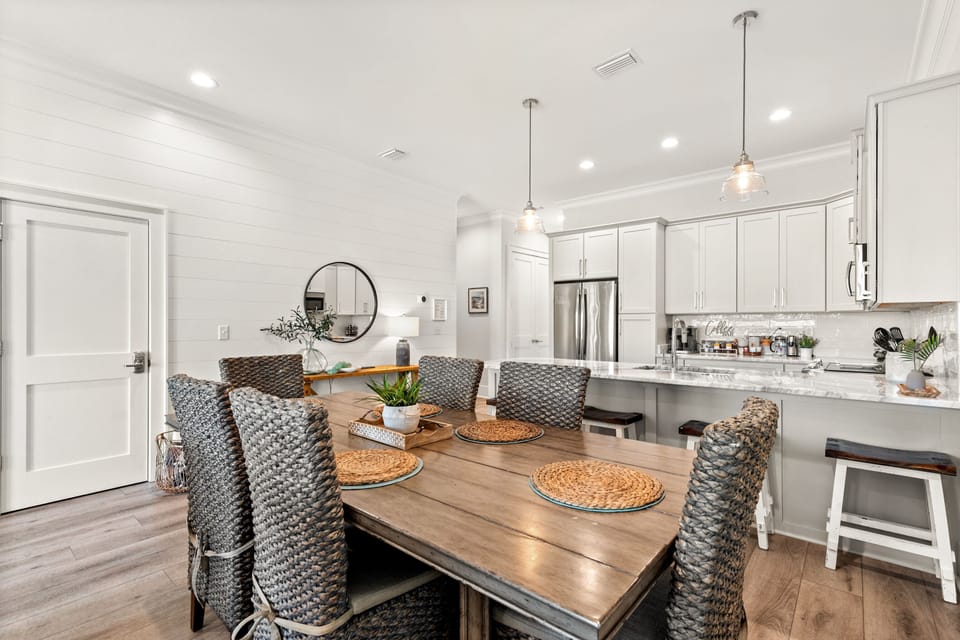 Dining table with 6 chairs plus 4 stools under counter