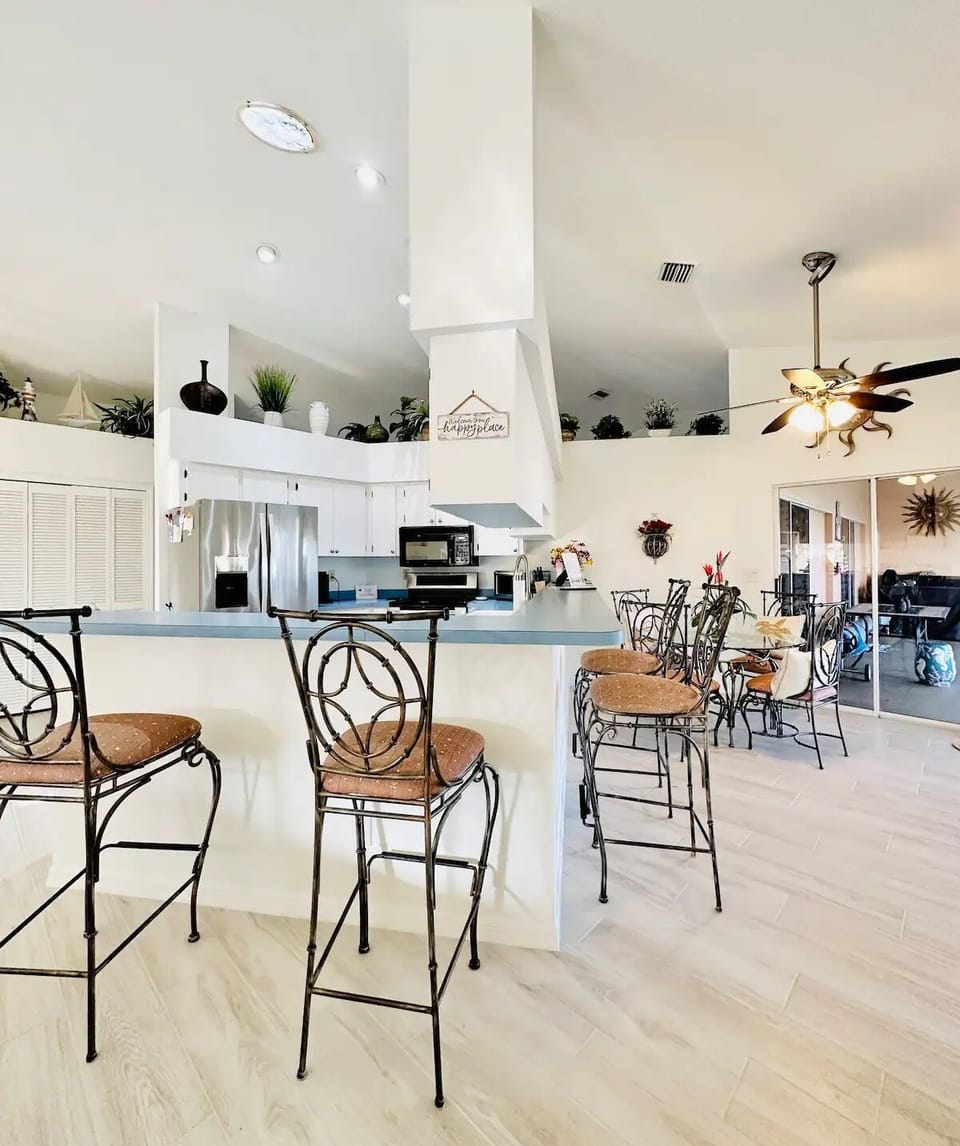 Kitchen with counter dining with seating for 4  and kitchen table 