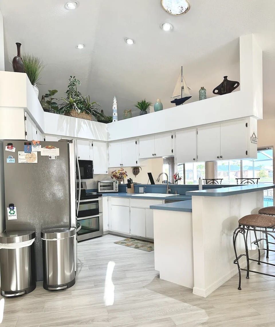 Kitchen with counter view of pool and canal.