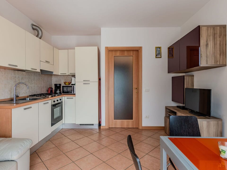 Cabinetry, Furniture, Countertop, Home Appliance, Wood, Kitchen, Interior Design, Kitchen Stove, Flooring, Floor