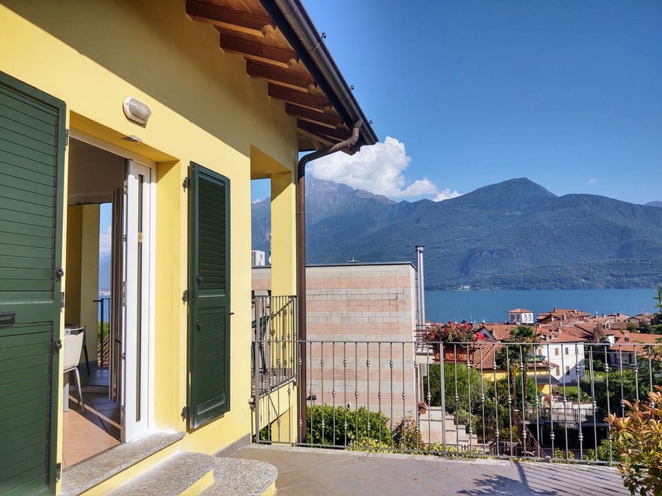 Sky, Building, Plant, Property, Azure, Mountain, Architecture, Cloud, Shade, Window