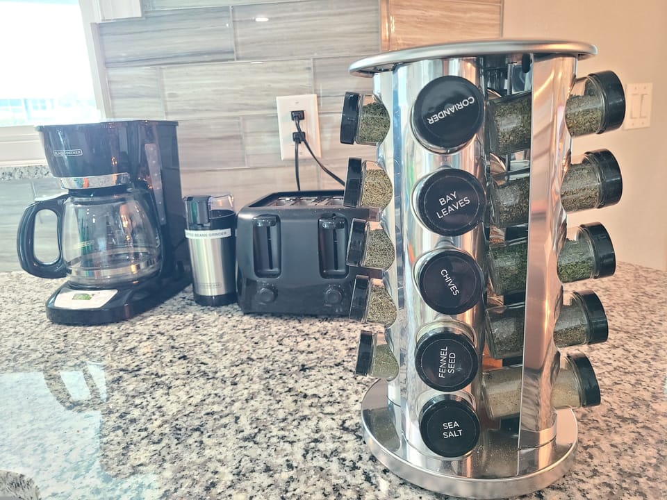 25 basic spices and variety of other miscellaneous in kitchen, well stocked.
